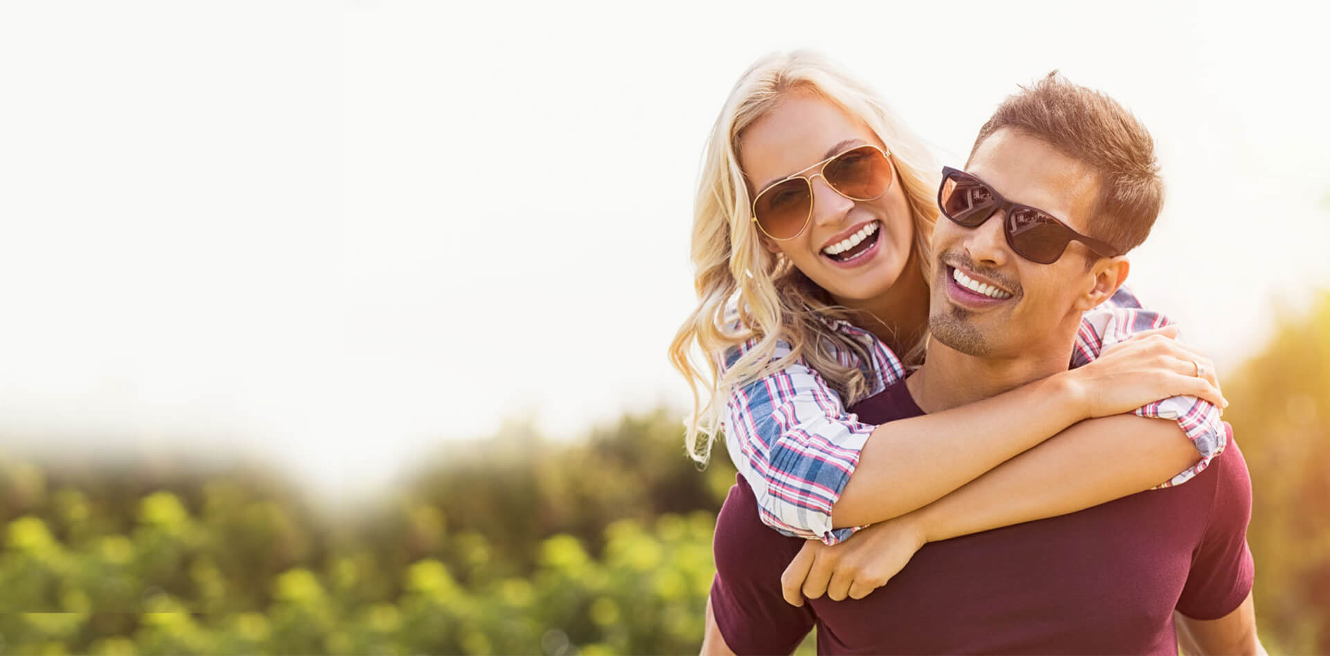 couple wearing sunglasses and smiling