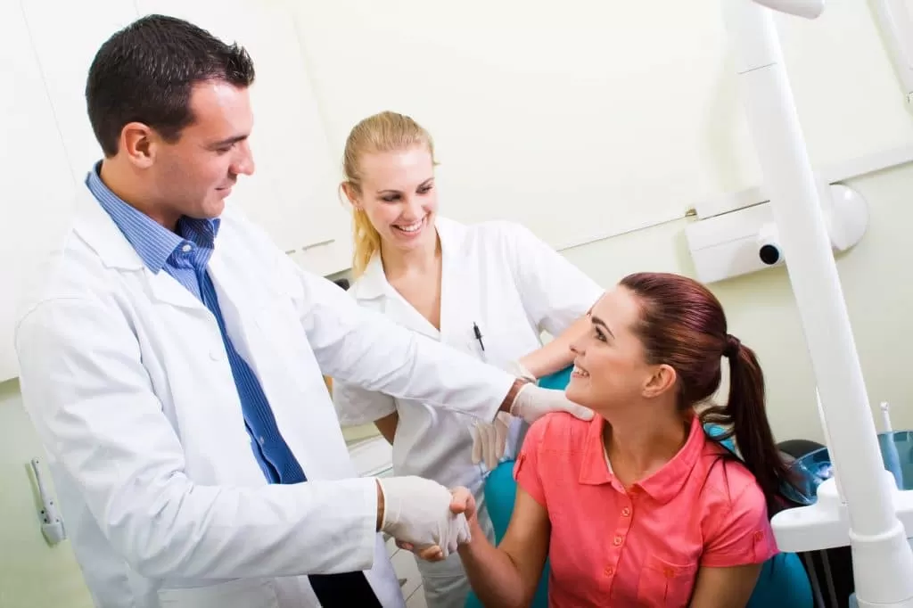 cosmetic dentist in Stuart thanking his patient