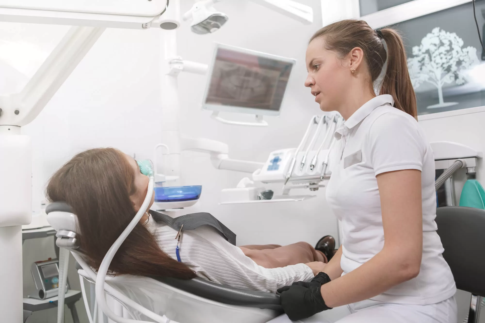 patient receiving dental sedation from dentist