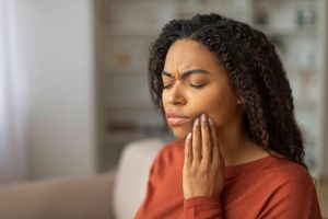 woman in pain from a dental emergency